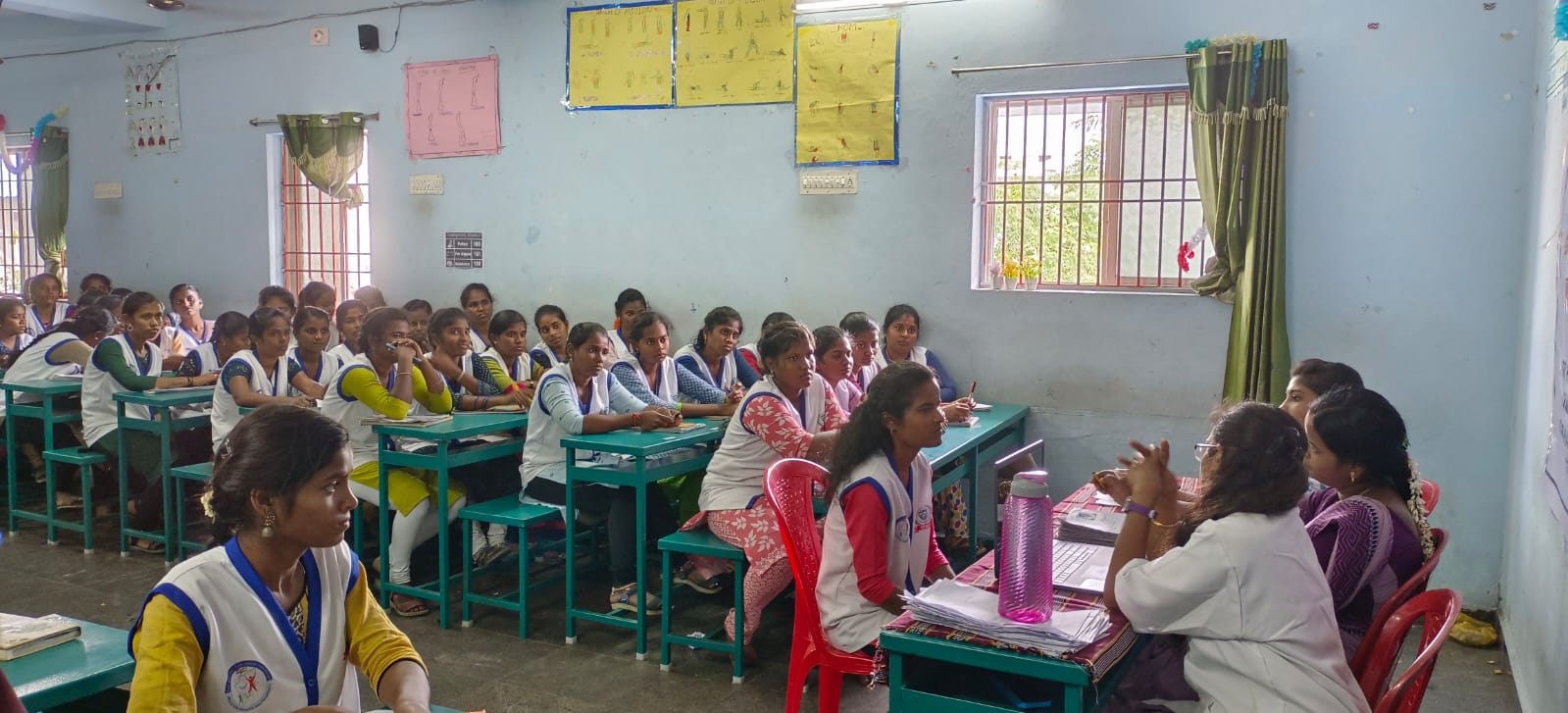 Students attending an educational awareness session in a classroom
