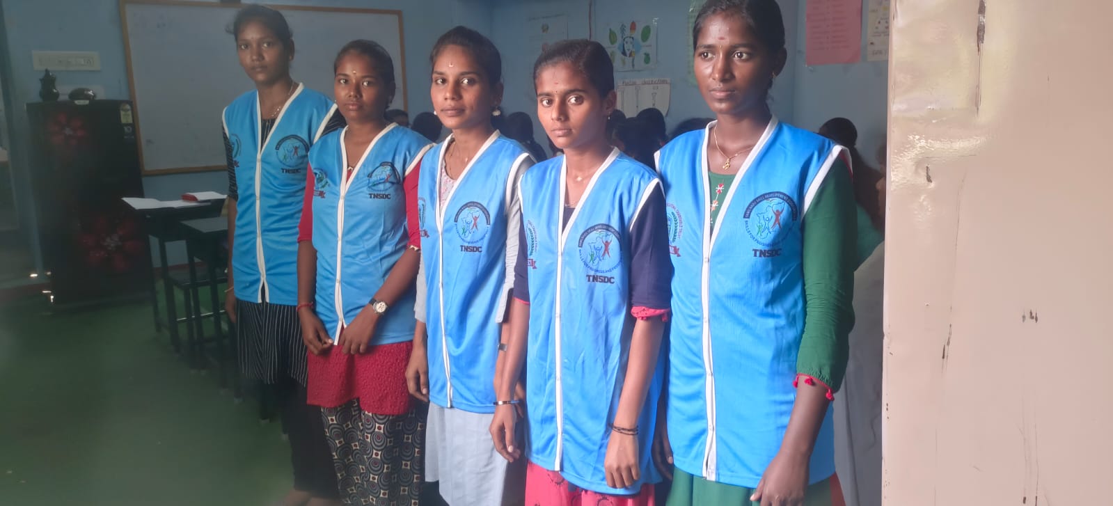 Students standing together in blue training uniforms